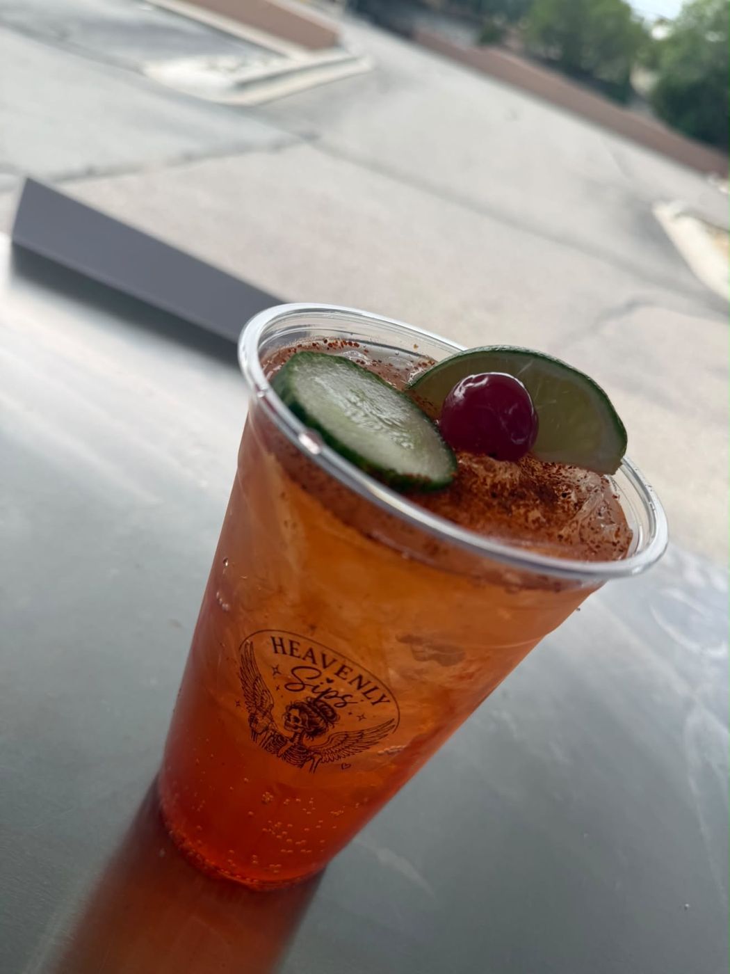 Fuego Fizz with cucumber, lime and a cherry on top