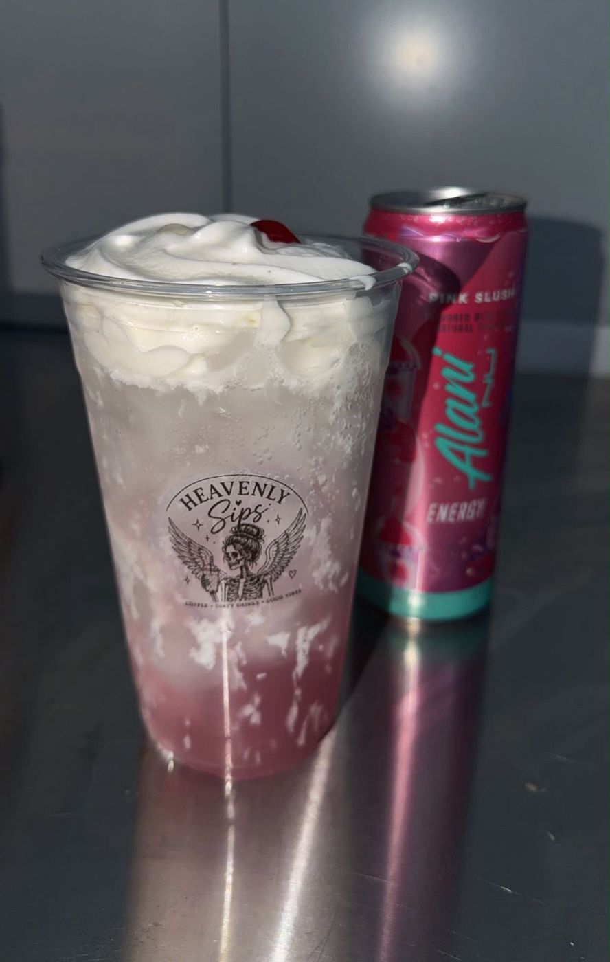 Pink Slush Alani with whipped cream and a cherry