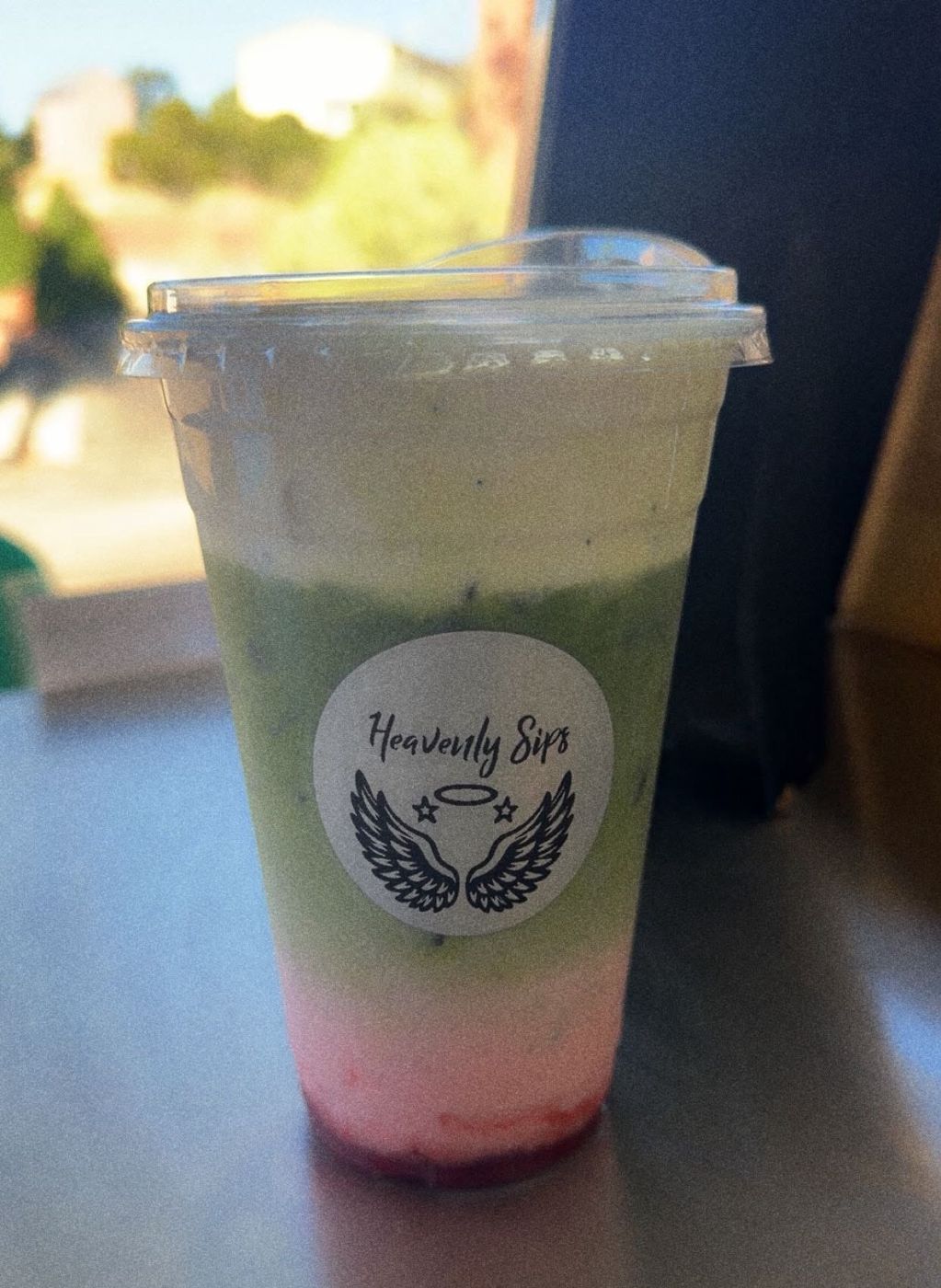 Strawberry matcha with a Heavenly Sips sticker